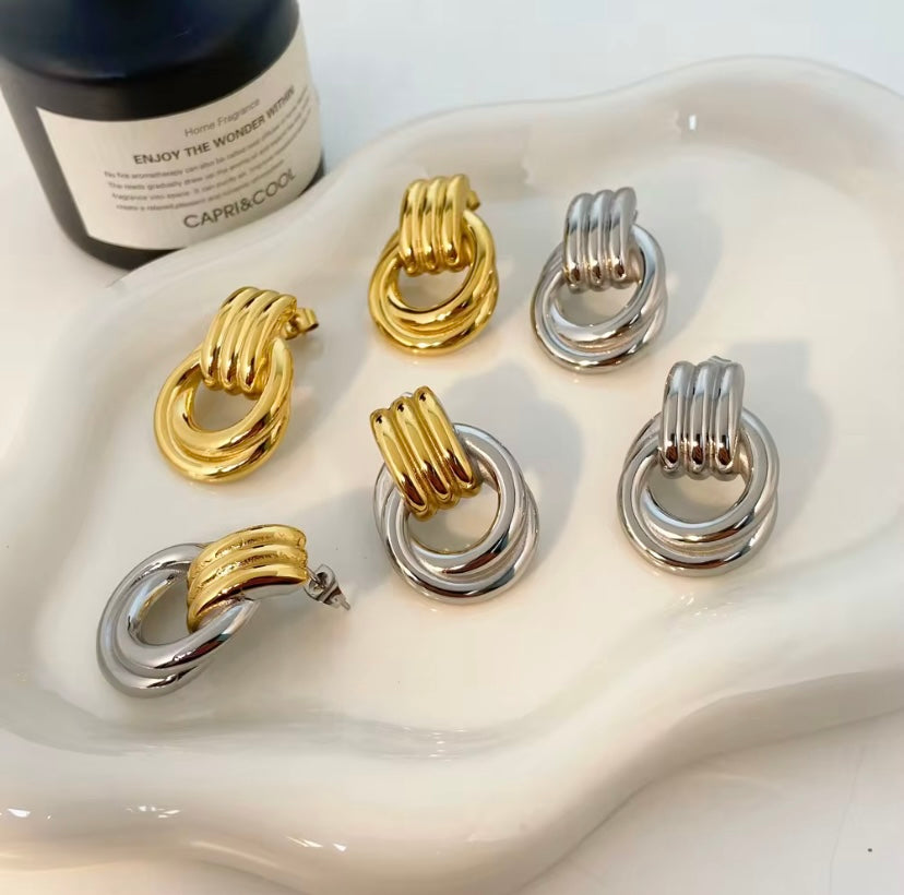 18k gold plated and silver tone stainless steel chunky twisted knot drop earrings in gold, silver, and two-tone, hypoallergenic tarnish resistant sculptural statement earrings by The Intertwined Collective, Dallas Texas