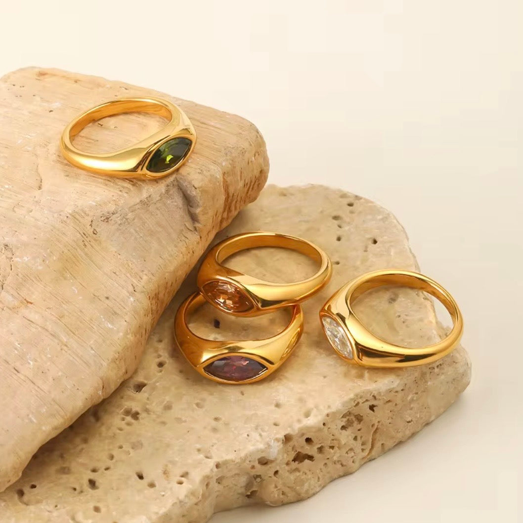 18k gold plated stainless steel marquise CZ dome signet ring with flush bezel-set marquise stone in amethyst purple and olive green, hypoallergenic tarnish resistant minimal statement ring by The Intertwined Collective
