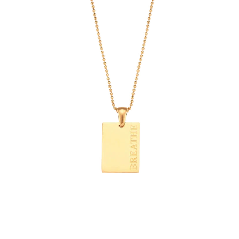 18k gold plated stainless steel affirmation tag pendant necklace on delicate ball chain with engraving options More Self Love, Made of Magic, Loved, and Breathe, hypoallergenic tarnish resistant meaningful gift necklace by The Intertwined Collective, Dallas Texas
