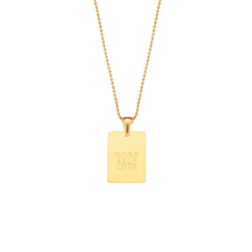 18k gold plated stainless steel affirmation tag pendant necklace on delicate ball chain with engraving options More Self Love, Made of Magic, Loved, and Breathe, hypoallergenic tarnish resistant meaningful gift necklace by The Intertwined Collective, Dallas Texas