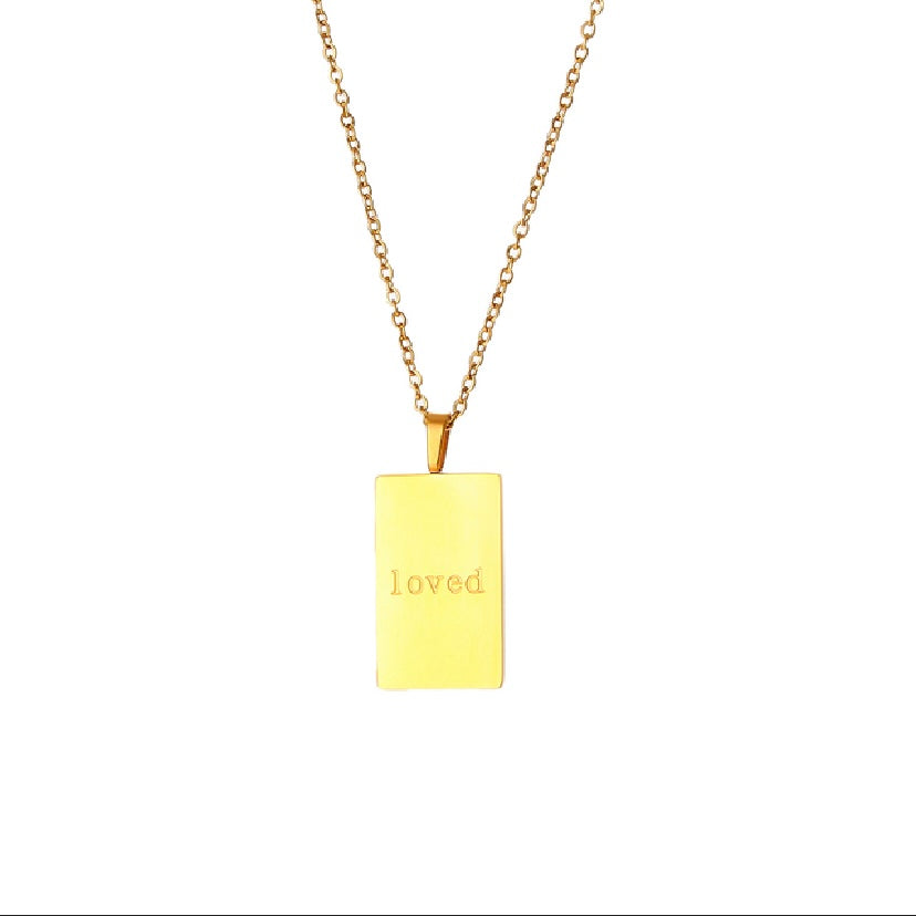 18k gold plated stainless steel affirmation tag pendant necklace on delicate ball chain with engraving options More Self Love, Made of Magic, Loved, and Breathe, hypoallergenic tarnish resistant meaningful gift necklace by The Intertwined Collective, Dallas Texas