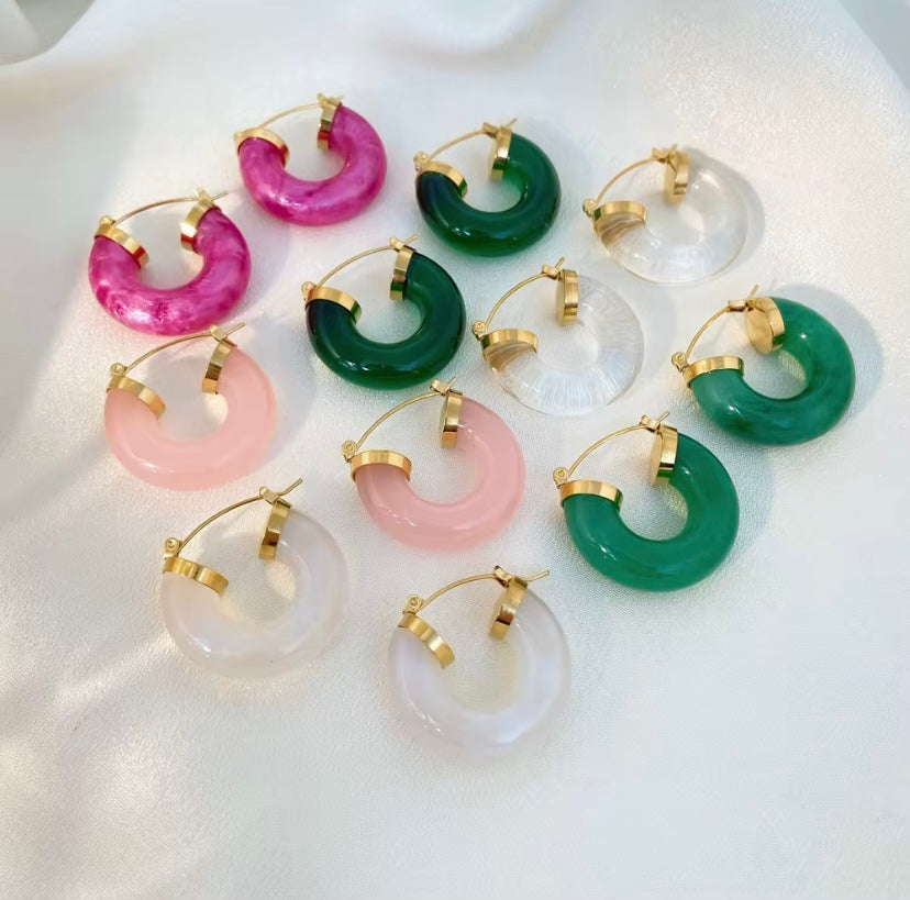 Chunky polished resin C-hoop earrings with gold latch back hardware in hot pink, light pink, emerald green, and clear, hypoallergenic tarnish resistant colorful statement hoops by The Intertwined Collective, Dallas Texas