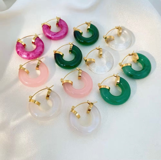 Chunky polished resin C-hoop earrings with gold latch back hardware in hot pink, light pink, emerald green, and clear, hypoallergenic tarnish resistant colorful statement hoops by The Intertwined Collective, Dallas Texas
