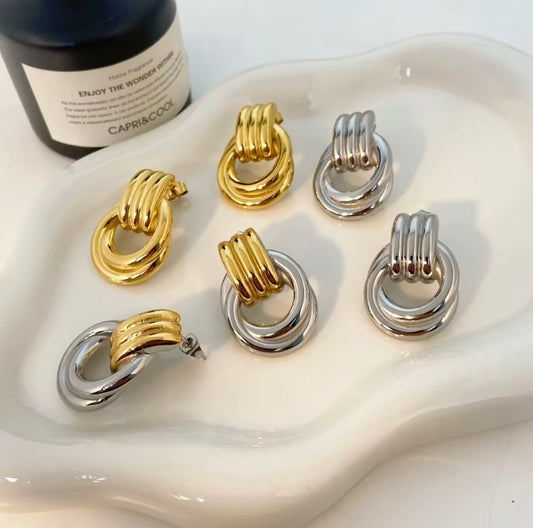 18k gold plated and silver tone stainless steel chunky twisted knot drop earrings in gold, silver, and two-tone, hypoallergenic tarnish resistant sculptural statement earrings by The Intertwined Collective, Dallas Texas