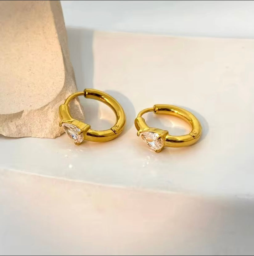 18k gold plated stainless steel heart CZ huggie hoop earrings with single prong-set heart crystal, hypoallergenic tarnish resistant dainty everyday earrings by The Intertwined Collective, Dallas Texas