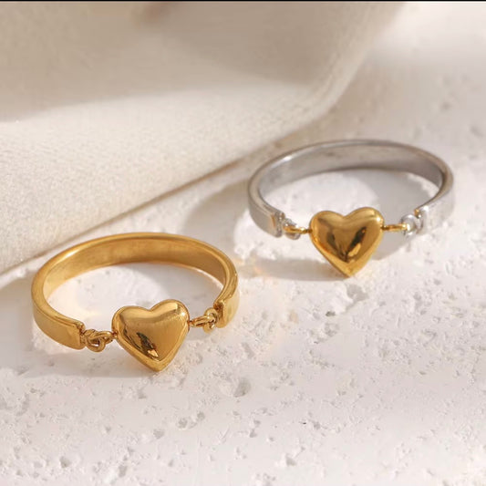 Gold and two‑tone open band rings with linked 3D puffy heart charm centerpiece on textured white surface – hypoallergenic water and tarnish resistant heart rings