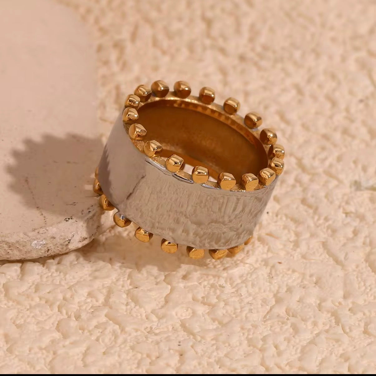 Two-tone wide band ring — brushed silver & gold ball-edge trim. Hypoallergenic, tarnish resistant & water resistant. Shop now – The Intertwined Collective, Dallas TX.