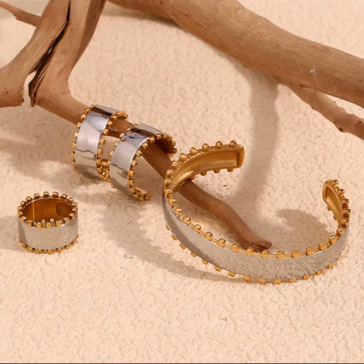 Two-tone wide open cuff bracelet with brushed silver center and gold ball-stud border edges, hypoallergenic tarnish resistant statement cuff by The Intertwined Collective, Dallas Texas