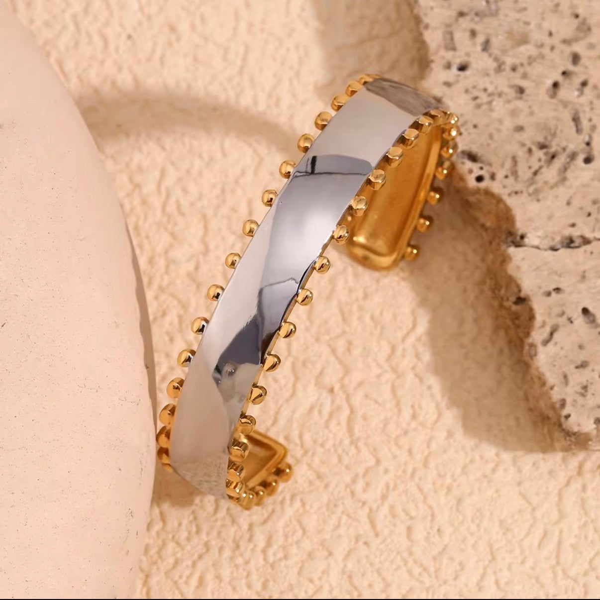 Two-tone wide open cuff bracelet with brushed silver center and gold ball-stud border edges, hypoallergenic tarnish resistant statement cuff by The Intertwined Collective, Dallas Texas