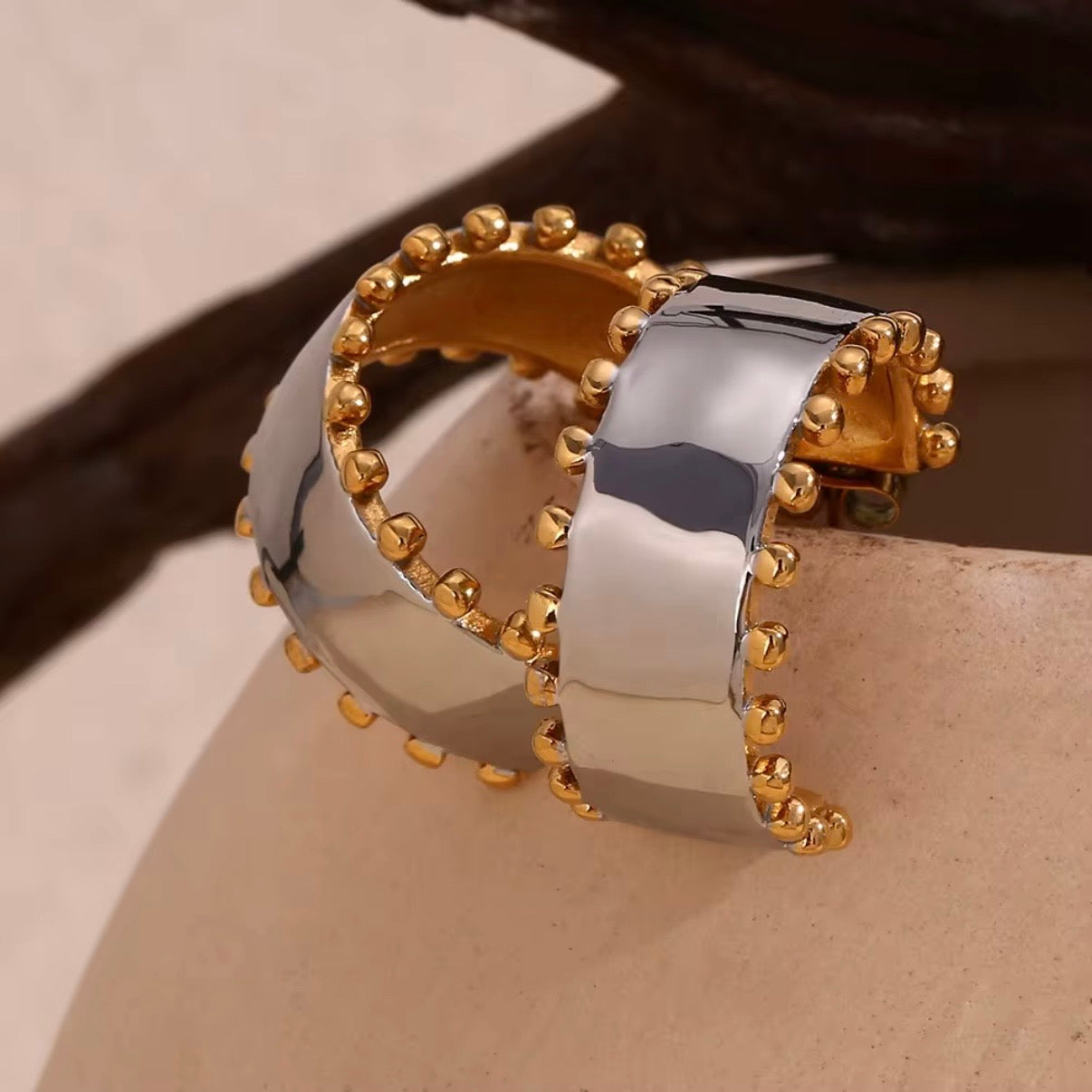 Two-tone wide flat hoop earrings with brushed silver center and gold ball-stud border edge, hypoallergenic tarnish resistant statement hoops by The Intertwined Collective, Dallas Texas