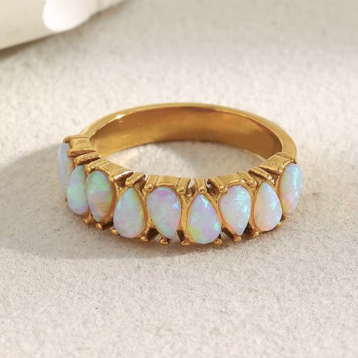 18k gold plated stainless steel pear opal eternity band ring with continuous prong-set faux opal cabochons, iridescent rainbow flash, hypoallergenic tarnish resistant everyday ring by The Intertwined Collective