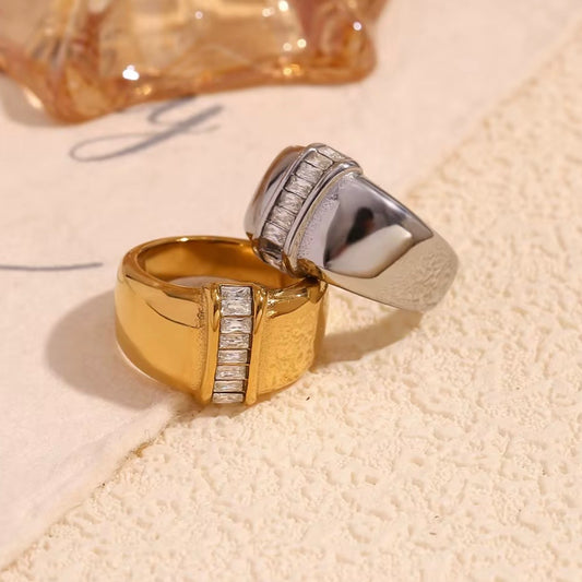 18k gold plated and silver tone stainless steel wide dome signet ring with vertical channel-set baguette CZ center, hypoallergenic tarnish resistant fine jewelry-inspired statement ring by The Intertwined Collective