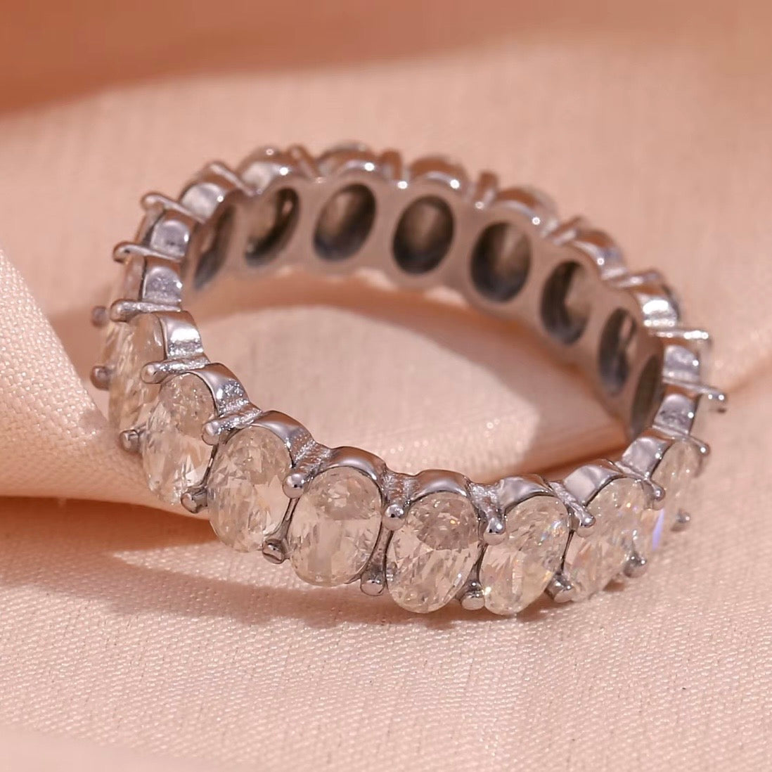 18k gold plated and silver tone stainless steel full eternity band ring with continuous prong-set oversized oval CZ stones, hypoallergenic tarnish resistant fine jewelry-inspired ring by The Intertwined Collective