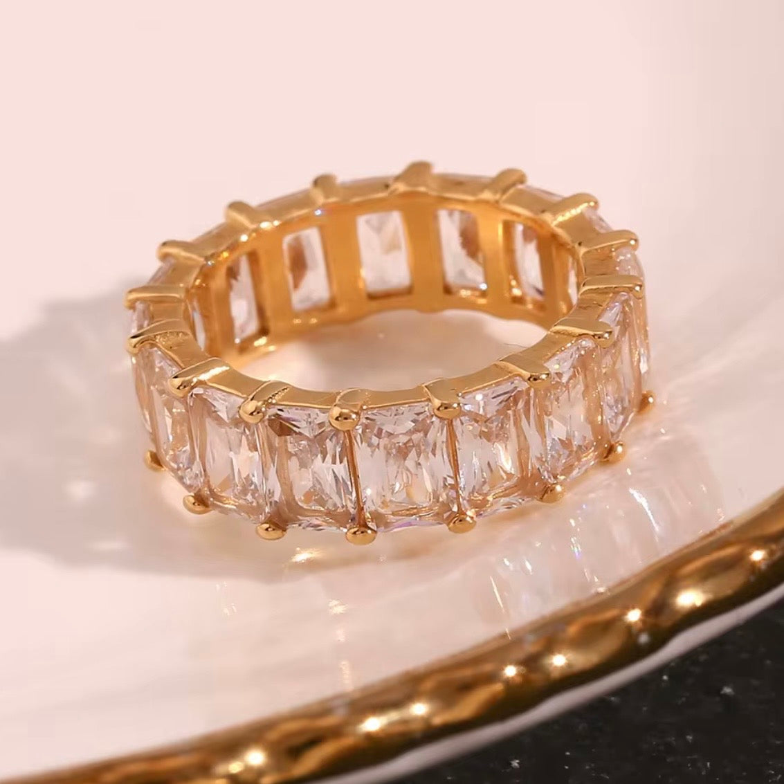 18k gold plated stainless steel full eternity band ring with continuous prong-set oversized emerald-cut clear CZ stones, hypoallergenic tarnish resistant fine jewelry-inspired ring by The Intertwined Collective