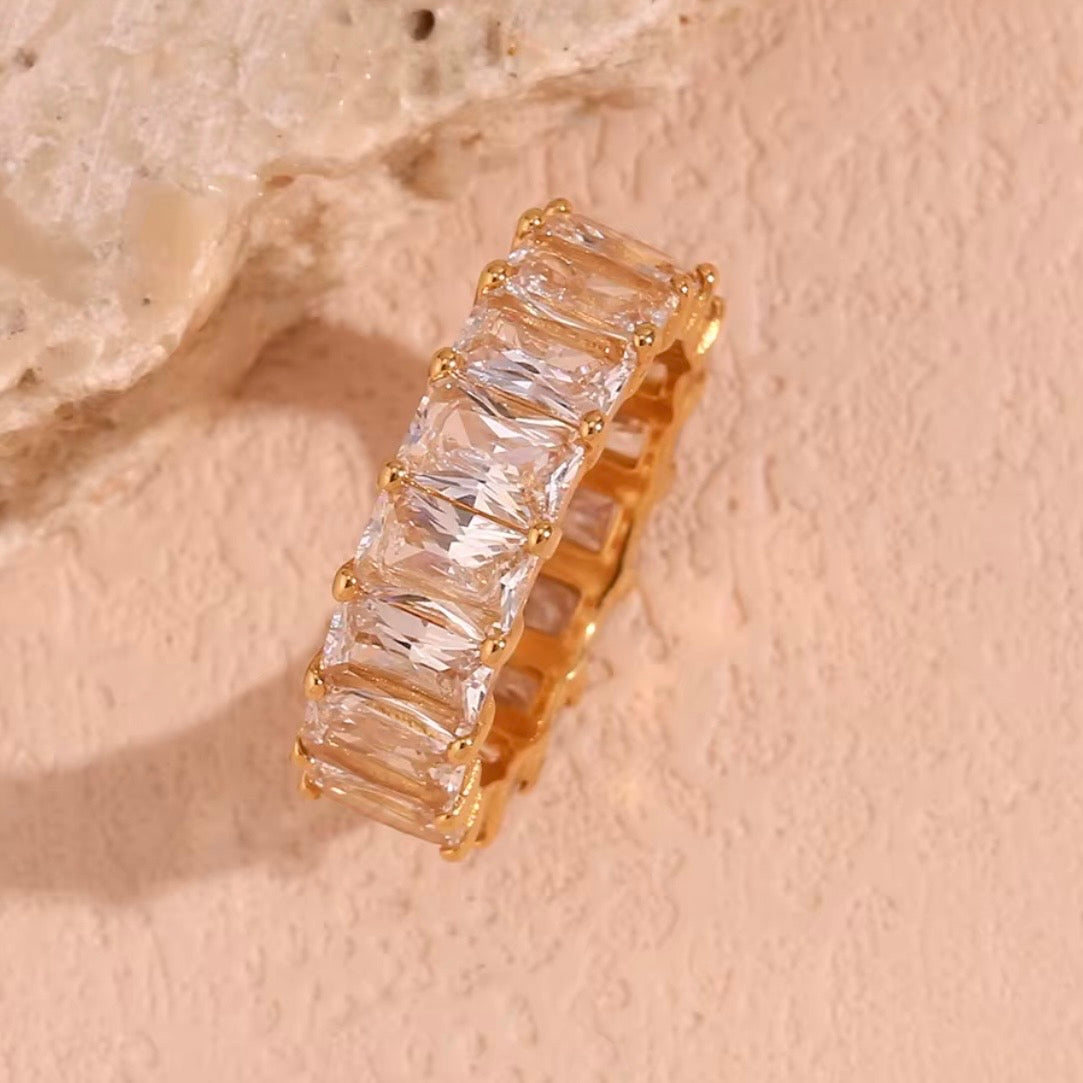 18k gold plated stainless steel full eternity band ring with continuous prong-set oversized emerald-cut clear CZ stones, hypoallergenic tarnish resistant fine jewelry-inspired ring by The Intertwined Collective