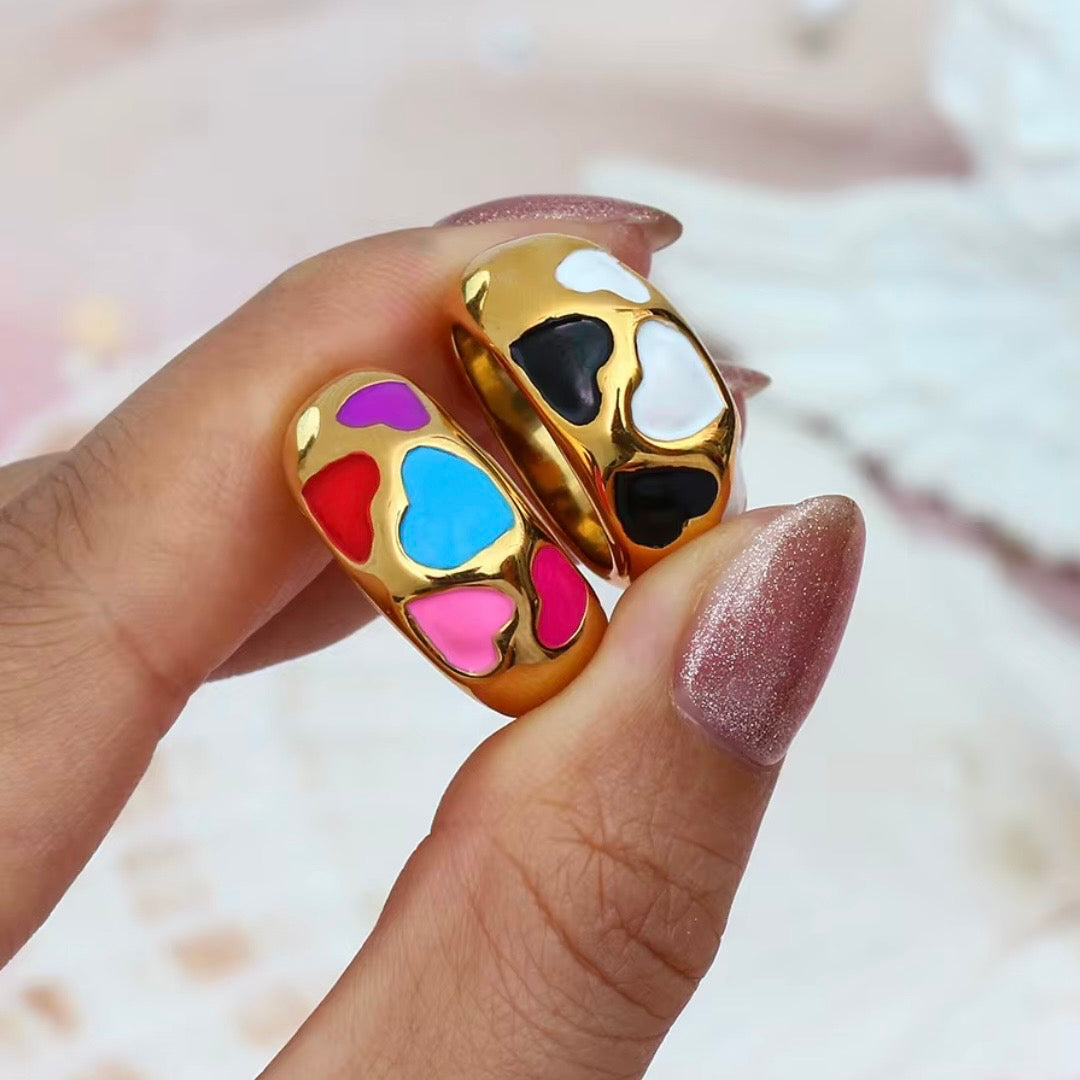 18k gold plated stainless steel wide dome statement ring with scattered black and white enamel heart inlay cutouts, hypoallergenic tarnish resistant playful statement ring by The Intertwined Collective