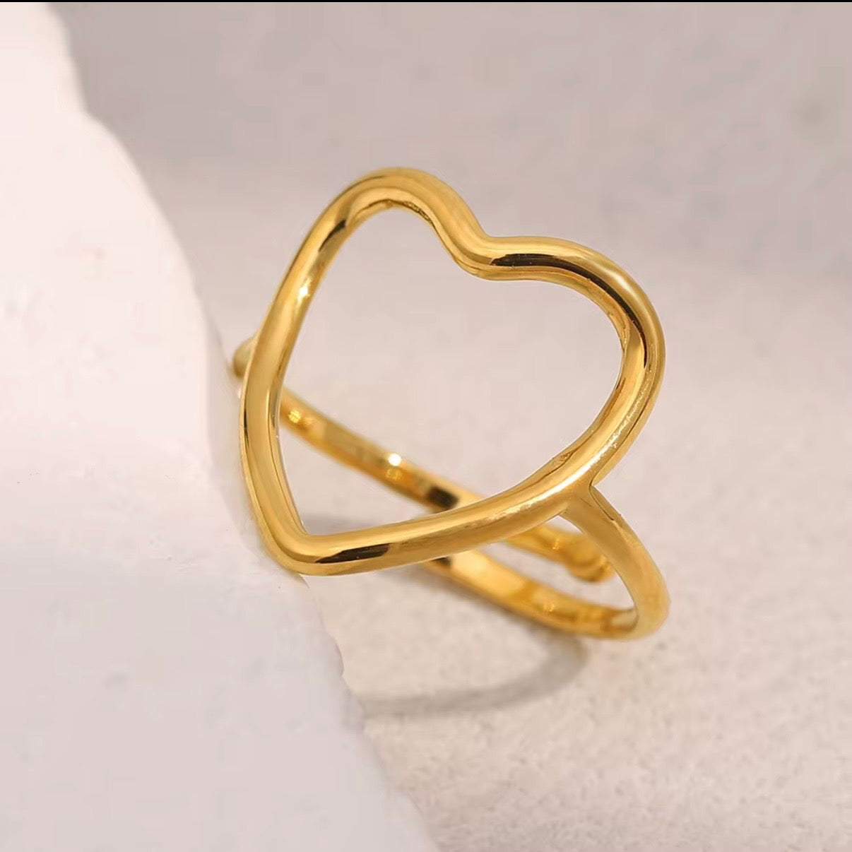 18k gold plated stainless steel open heart outline ring with oversized high-polish wire heart silhouette on a slim delicate band, hypoallergenic tarnish resistant minimalist romantic ring by The Intertwined Collective