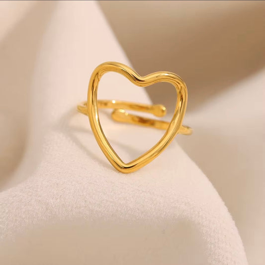 18k gold plated stainless steel open heart outline ring with oversized high-polish wire heart silhouette on a slim delicate band, hypoallergenic tarnish resistant minimalist romantic ring by The Intertwined Collective
