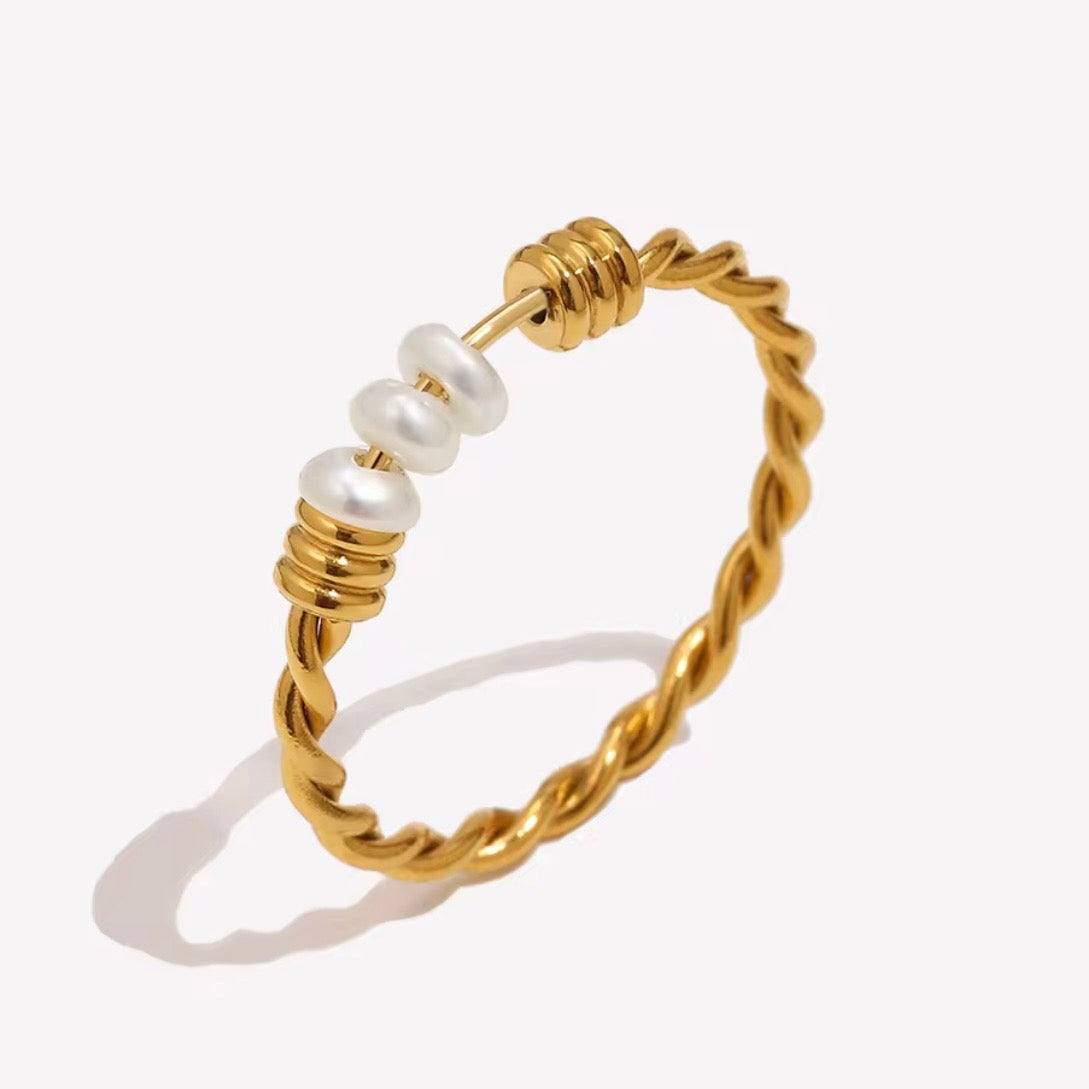18k gold plated stainless steel twisted rope ring with freshwater pearl slider bar detail and ribbed gold disc spacers, hypoallergenic tarnish resistant elegant everyday ring by The Intertwined Collective