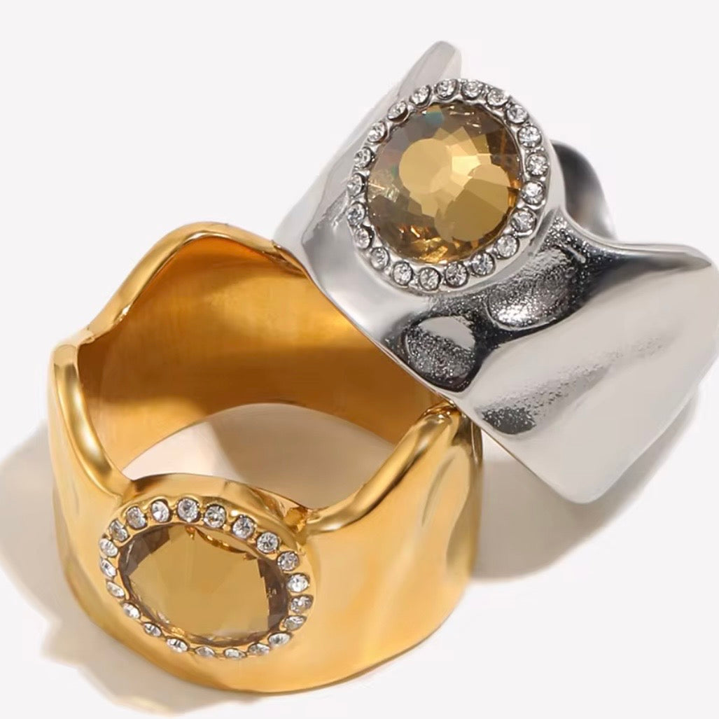 18k gold plated and silver tone stainless steel wide dome cocktail ring with large oval amber CZ center stone and round clear CZ halo, hypoallergenic tarnish resistant statement ring by The Intertwined Collective