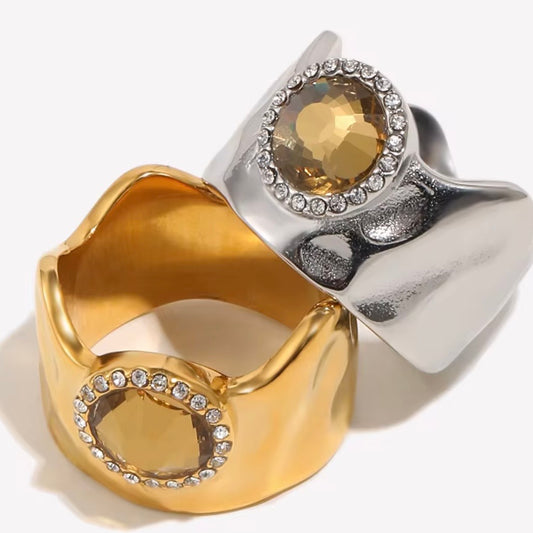 18k gold plated and silver tone stainless steel wide dome cocktail ring with large oval amber CZ center stone and round clear CZ halo, hypoallergenic tarnish resistant statement ring by The Intertwined Collective