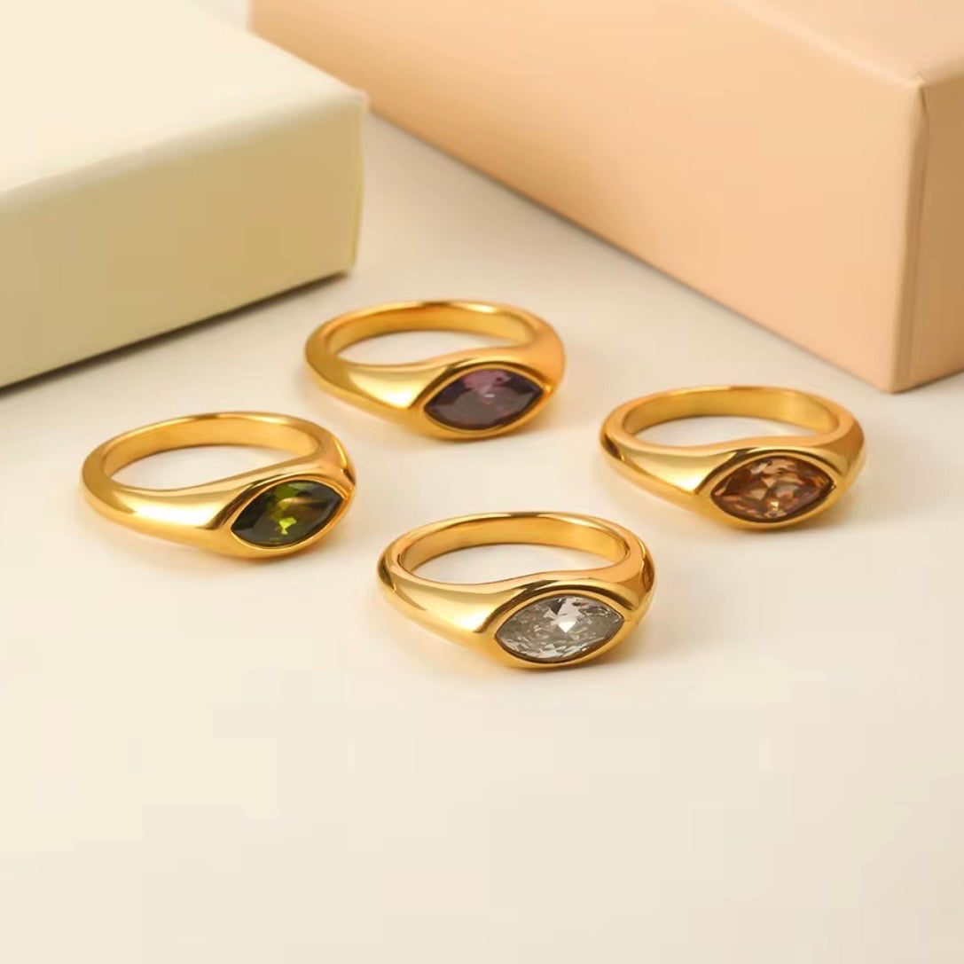 18k gold plated stainless steel marquise CZ dome signet ring with flush bezel-set marquise stone in amethyst purple and olive green, hypoallergenic tarnish resistant minimal statement ring by The Intertwined Collective